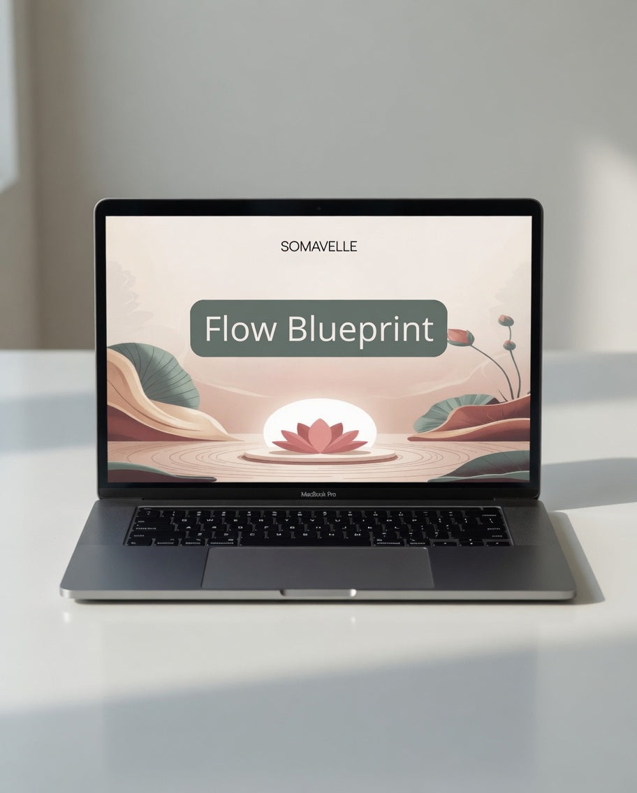 Laptop displaying 'Flow Blueprint' by SOMAVELLE on a white surface with a blurred background
